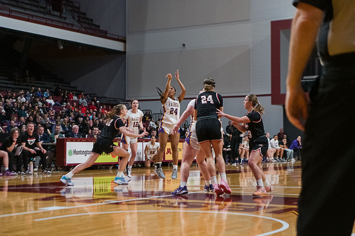 Senior Tank Edwards takes the shot as Junior teammate Sage Gilbert looks on during their win over Monticello in the State quarter finals.